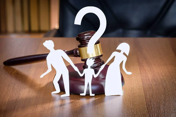 Child has question mark in court when parents divorce. Family and child divorce concept. Rghts of the child in court when family divorces. legal zone of children.