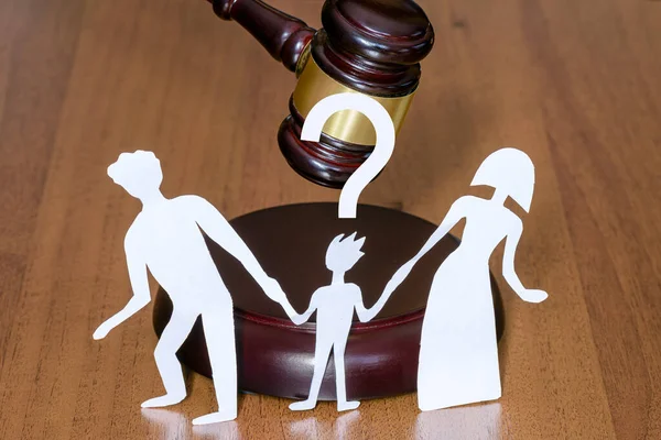 Child has question mark in court when parents divorce. Family and child divorce concept. Rghts of the child in court when family divorces. legal zone of children.