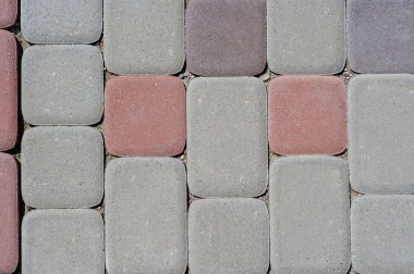 Taş döşemeler için tasarlanmış soyut bir arka plan. Döşeme dokusunun yüzeyi yakın plan.