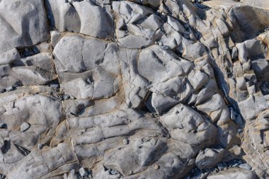 Koyu gri bir taşın dokusu veya tasarım için arkaplan