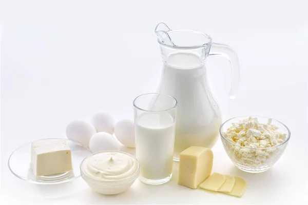 Milk, cottage cheese, sour cream, cheese, butter, eggs, still life from healthy dairy products. Dairy nutrition is good for children\'s health. Homemade milk and what can be made from milk.