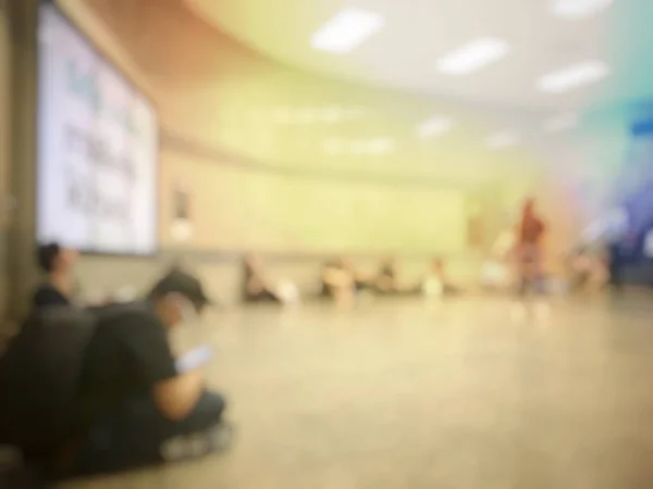 Blurred people in airport hall waiting for flight