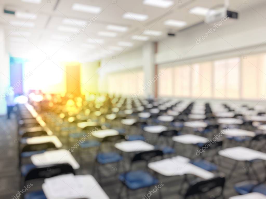 Education concept, Abstract blurred background image of students and business people  studying and discuss in large hall profession seminar with screen and projector for showing information.