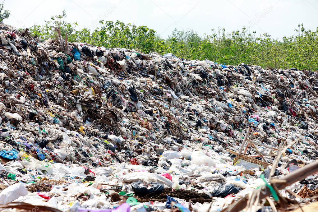 Mountain garbage, large and degraded garbage pile, Pile of stink and toxic residue, waste plastic bottles and other types of plastic waste site in trash dump or landfill. Pollution concept.