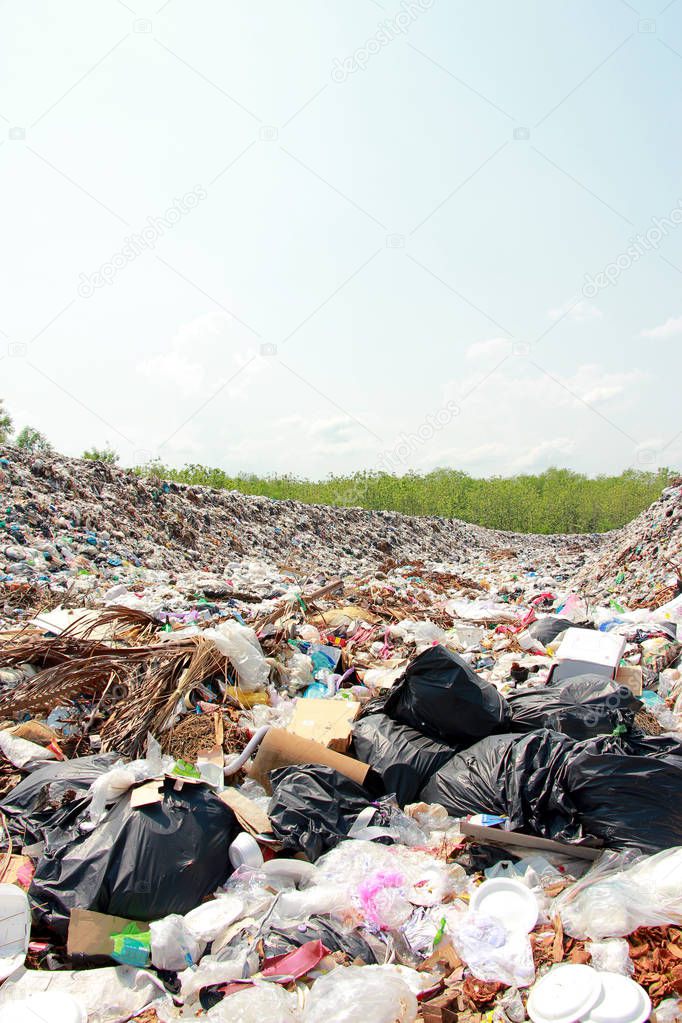 Mountain garbage, large and degraded garbage pile, Pile of stink and toxic residue, waste plastic bottles and other types of plastic waste site in trash dump or landfill. Pollution concept.