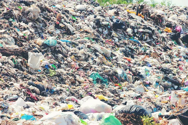 Mountain garbage, large and degraded garbage pile, Pile of stink and toxic residue, waste plastic bottles and other types of plastic waste site in trash dump or landfill. Pollution concept.