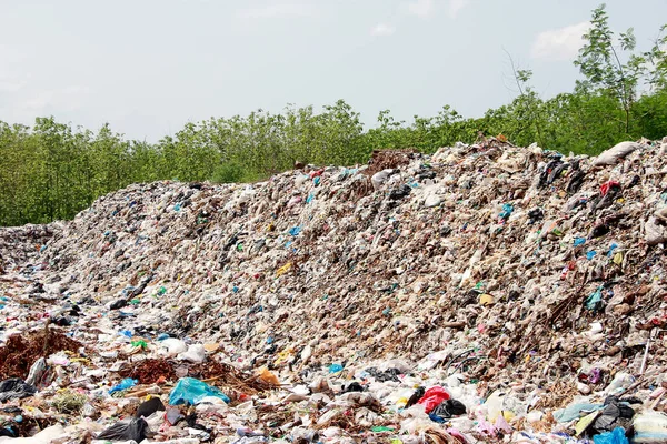 Mountain garbage, large and degraded garbage pile, Pile of stink and toxic residue, waste plastic bottles and other types of plastic waste site in trash dump or landfill. Pollution concept.