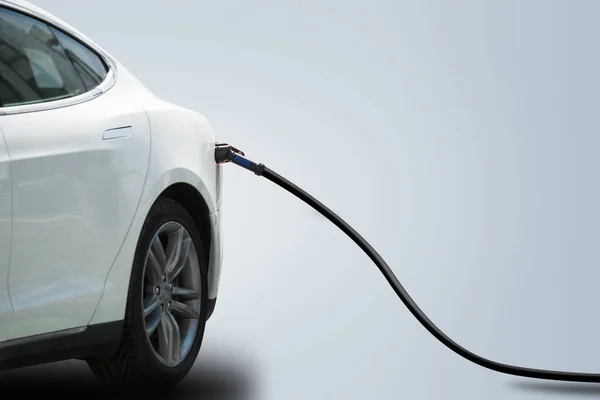 Charging electric car isolated on grey background — Stock Photo, Image