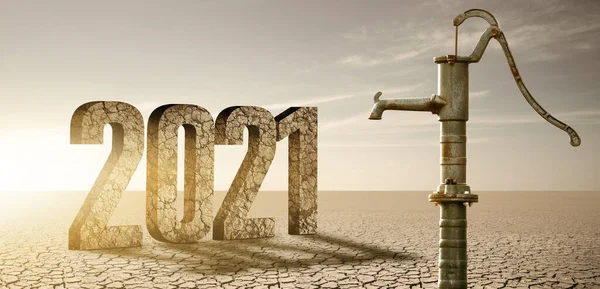 Droge gebarsten woestijn met roestige waterpomp en cijfers 2021 — Stockfoto