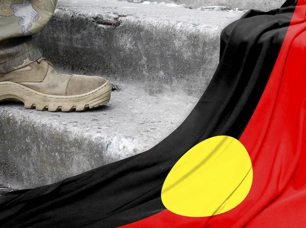 Military concept on the background of the flag of Australian Aboriginal