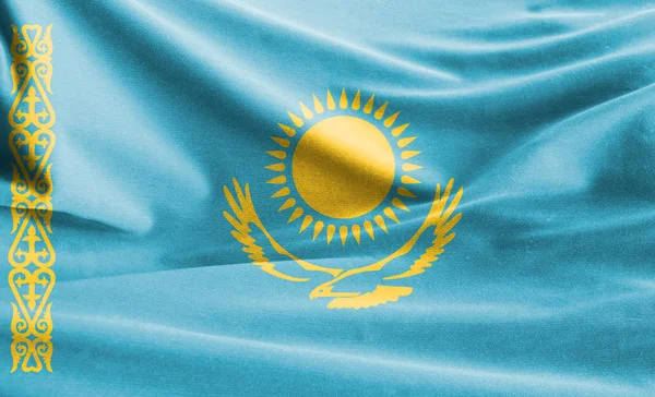 Realistic flag of Kazakhstan on the wavy surface of fabric