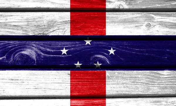 Netherlands Antilles flag painted on wooden background, closeup.