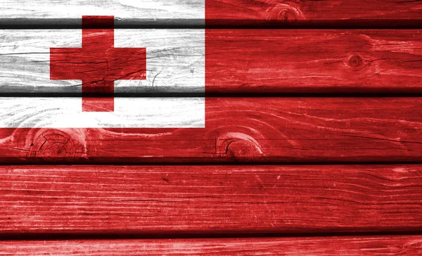 Tonga flag painted on wooden background, closeup.