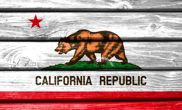 State of California flag painted on wooden background, closeup.