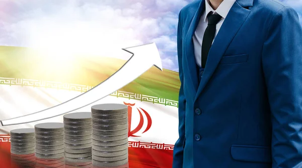 Business concept of increasing sales, Businessman on the background of the flag of Iran and a graph of increasing up.