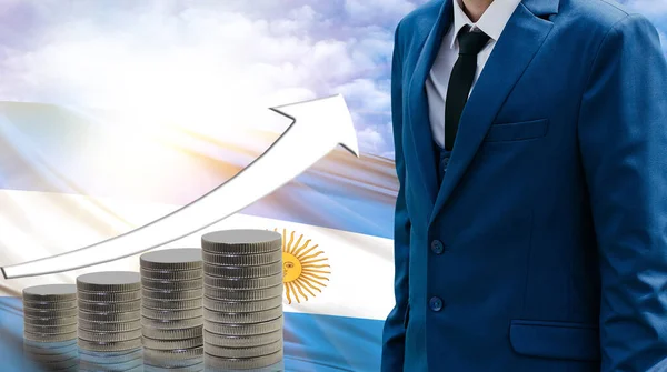 Business concept of increasing sales, Businessman on the background of the flag of Argentina and a graph of increasing up.