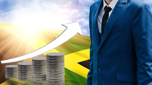 Business concept of increasing sales, Businessman on the background of the flag of Jamaica and a graph of increasing up.