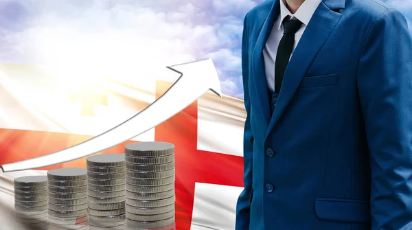 Business concept of increasing sales, Businessman on the background of the flag of England and a graph of increasing up.