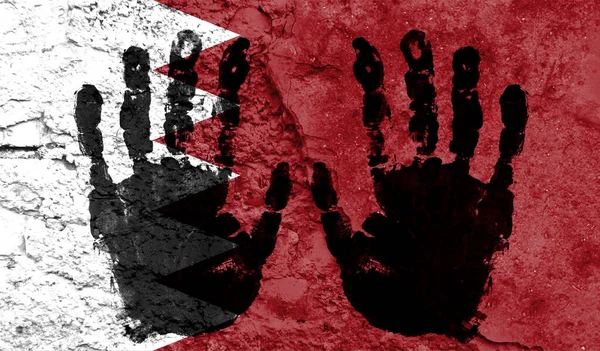 Handprints on the background of the flag of Bahrain. Freedom of choice, corruption, and detention concept