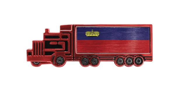 Toy truck with Liechtenstein flag shown isolated on white background. The concept of cargo transportation between countries.
