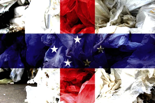 The flag Netherlands Antilles is shown on the trash bag. Ecology concept with environmental pollution from household and industrial waste.
