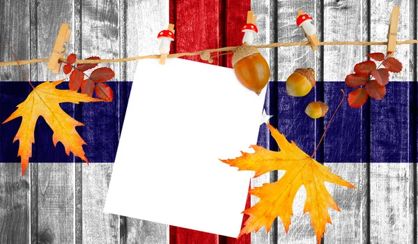 Netherlands Antilles flag on autumn wooden background with leaves and good place for your text.