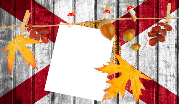 State of Florida flag on autumn wooden background with leaves and good place for your text.