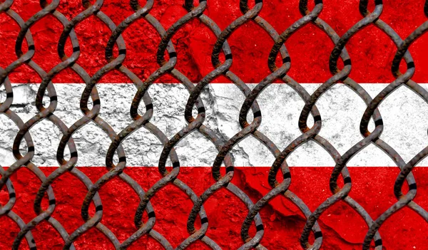 Immigration policy regarding migrants, illegal immigrants and refugees. Steel grid on the background of the flag of Austria