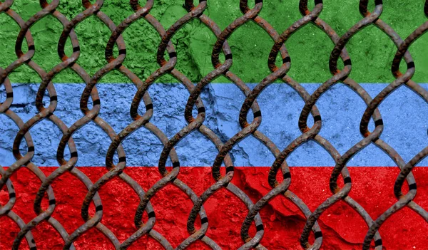 Immigration policy regarding migrants, illegal immigrants and refugees. Steel grid on the background of the flag of Dagestan