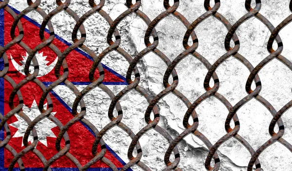 Immigration policy regarding migrants, illegal immigrants and refugees. Steel grid on the background of the flag of Nepal