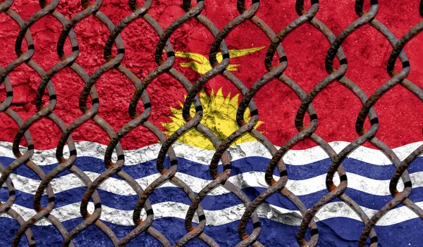 Immigration policy regarding migrants, illegal immigrants and refugees. Steel grid on the background of the flag of Kiribati