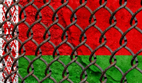 Immigration policy regarding migrants, illegal immigrants and refugees. Steel grid on the background of the flag of Belarus