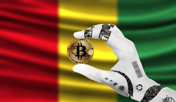 crypto currency bitcoin in the robot\'s hand, the concept of artificial intelligence, background flag of Guinea