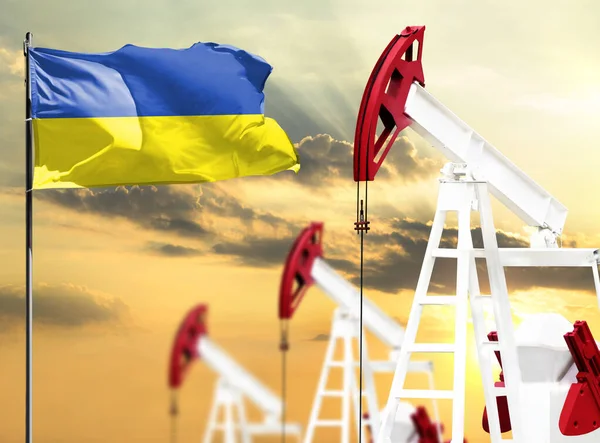 Oil rigs against the backdrop of the colorful sky and a flagpole with the flag of Ukraine. The concept of oil production, minerals, development of new deposits.
