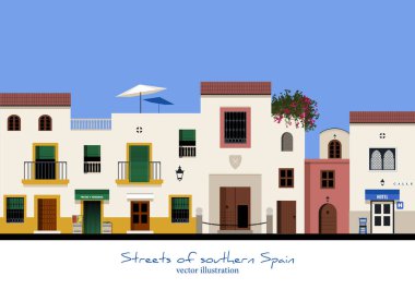 Tipik sokak Güney İspanya. Meyve ve sebze deposu ve otel. Balkonlu ve windows çubuklarla evleri.