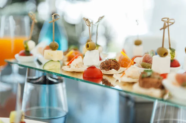 Snacks, fish and meat specialities on the buffet.