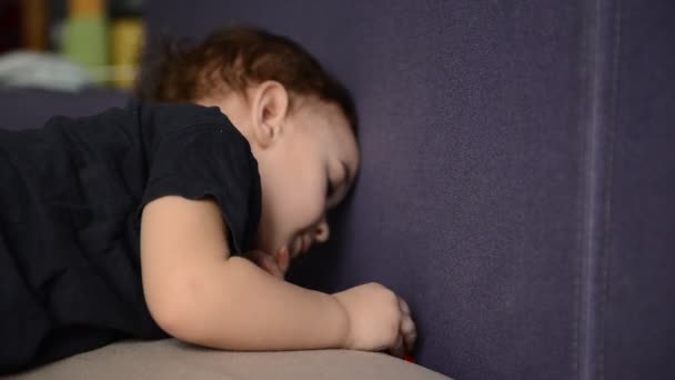 Little boy playing with toy car in the childrens room — Stock Video