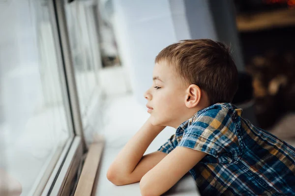 Very cute and beautiful teenager sitting near a window. — Stock Photo, Image
