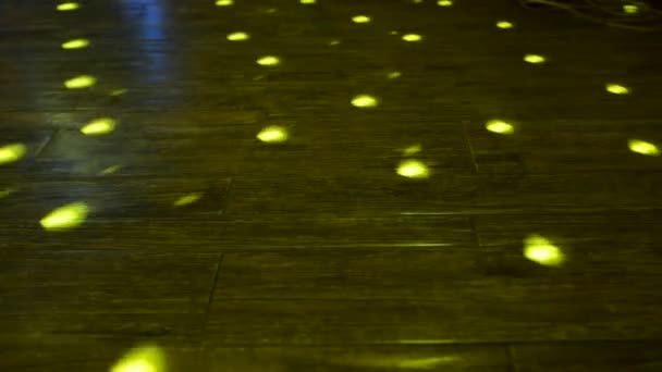 Rays from disco ball on wooden floor — Stock Video