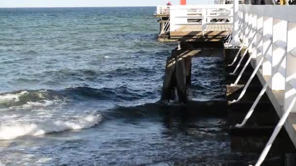 Wooden pier in Sopot in the spring. Good windy weather — Stock Video