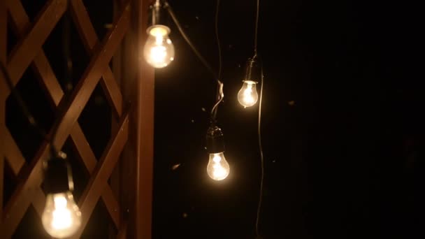 Lamps close up. Wedding garlands that glow on the arch. Vespers Wedding Ceremony — Stock Video