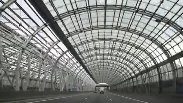 Car driving through a transparent tunnel at high speed — Stock Video