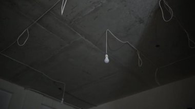 Concrete Ceiling of the apartment. Repair and installation of lighting. Evening