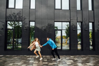 beautiful happy couple of lovers have fun in the city