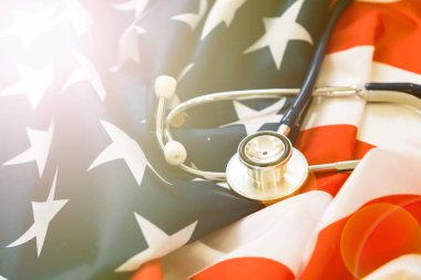 Close-up Photo Of Stethoscope On American Flag clipart