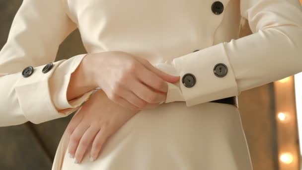 Close up of female hands checks the quality of the dress, syntheticl clothes. fashionable trendy look. slow motion shot — Stock Video