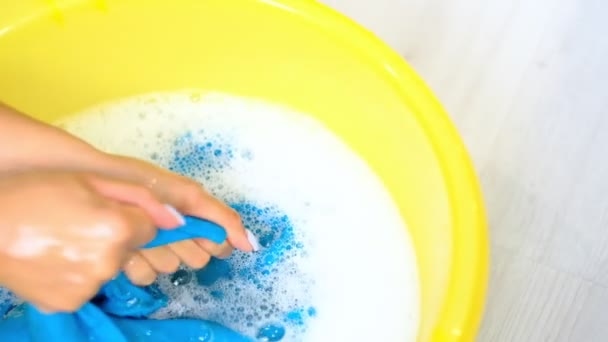 Slow motion asian female hands washing clothes in basin. wash stain of dirty clothing by hand with detergent — Stock Video