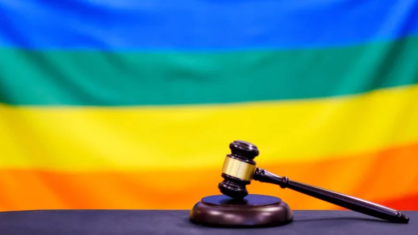 A gavel and a law book - Rainbow flag. — Stock Photo, Image