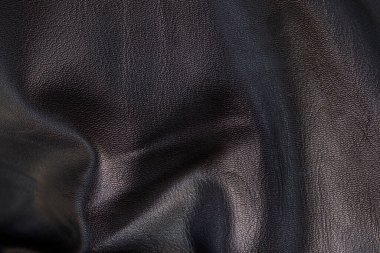 Siyah deri dokuları pürüzsüz. Katların yüksek çözünürlüklü dokusu. Siyah dana derisi.