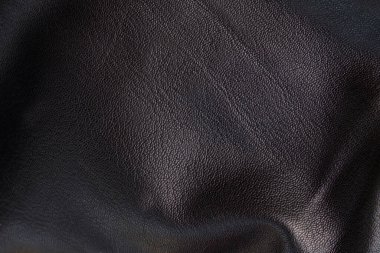 Siyah deri dokuları pürüzsüz. Katların yüksek çözünürlüklü dokusu. Siyah dana derisi.